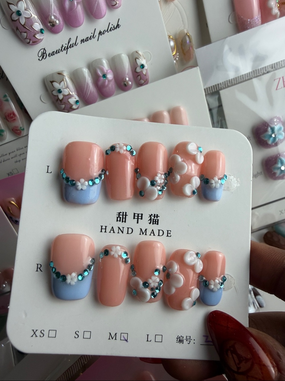 Short square baby blue french tips with 3d flowers
